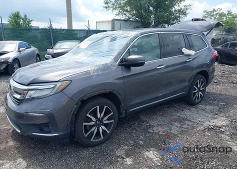 2019 Honda Pilot Touring z USA, uszkodzony, nr VIN 5FNYF6H61KB067739